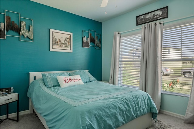 carpeted bedroom with ceiling fan