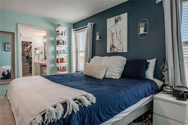 bedroom featuring ensuite bath