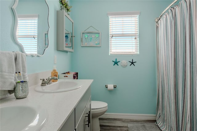 bathroom with hardwood / wood-style floors, vanity, toilet, and a shower with shower curtain