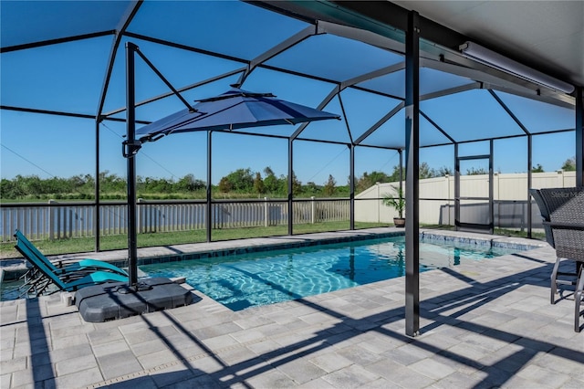 view of swimming pool featuring a lanai and a patio area