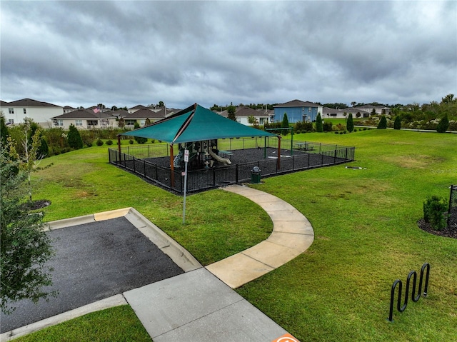 view of property's community featuring a yard