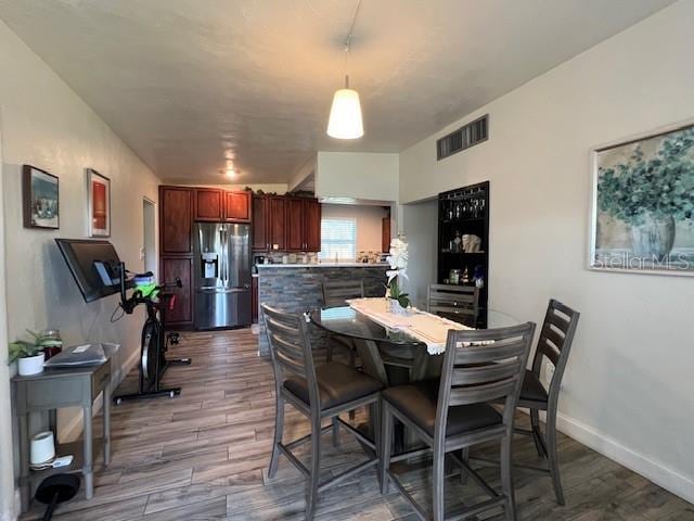 dining space featuring hardwood / wood-style floors