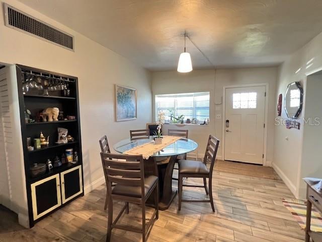 dining room with light hardwood / wood-style floors