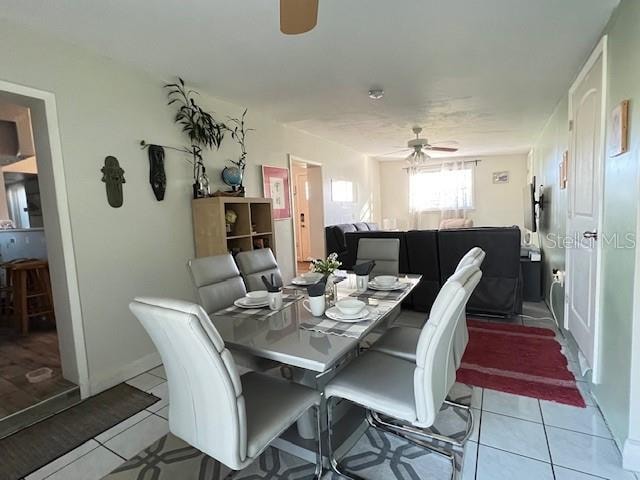 dining room featuring ceiling fan and light tile patterned flooring