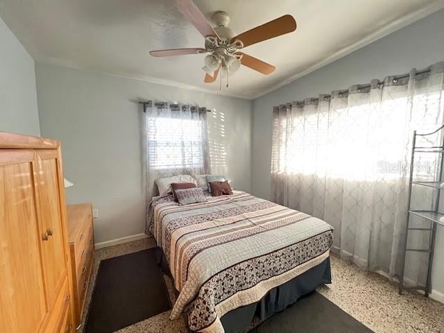 bedroom featuring carpet floors, crown molding, ceiling fan, and lofted ceiling