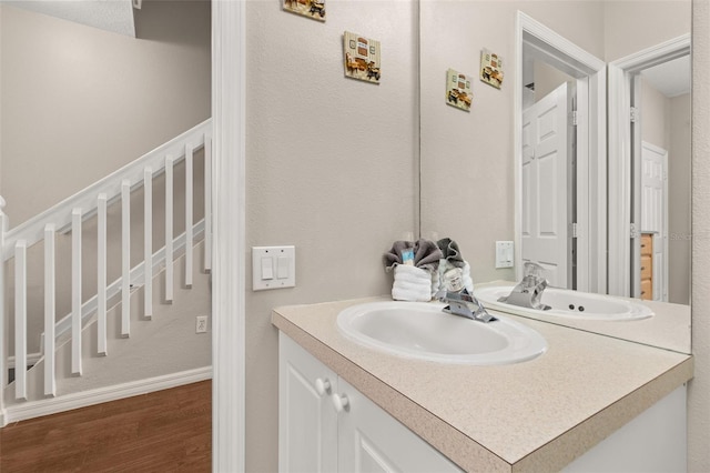 bathroom featuring wood-type flooring and vanity