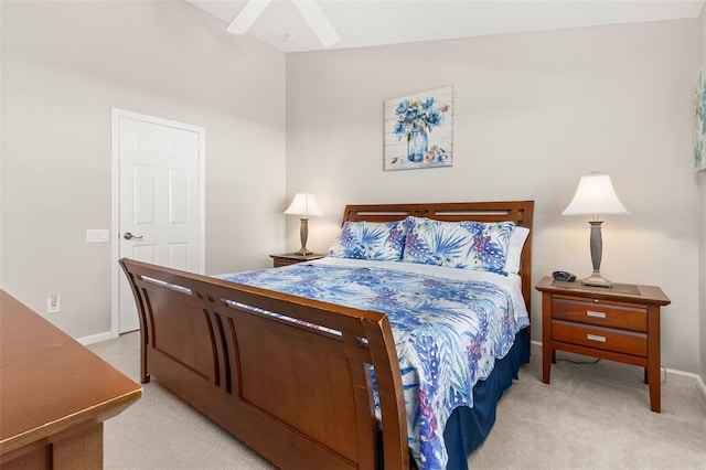 carpeted bedroom with ceiling fan and lofted ceiling