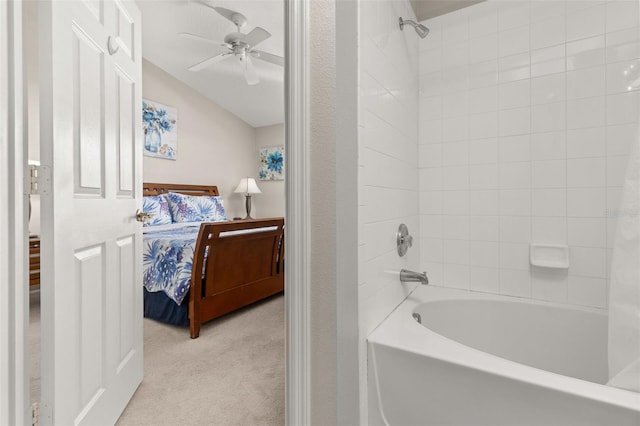 bathroom with tiled shower / bath combo and ceiling fan