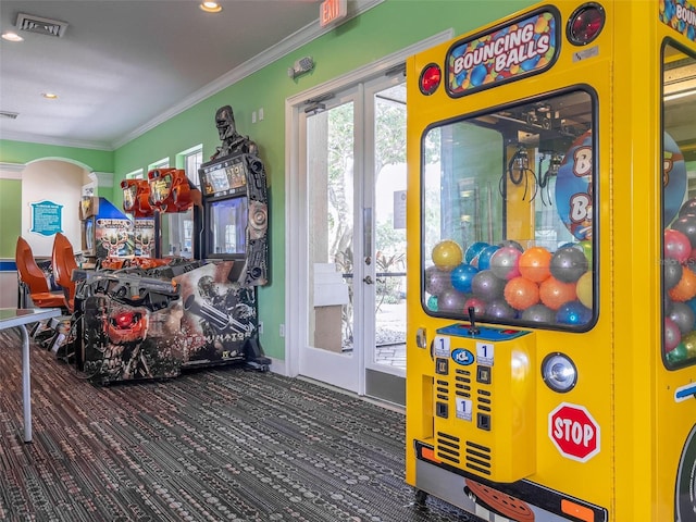 rec room with french doors and ornamental molding