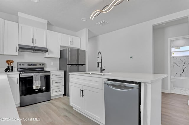 kitchen with white cabinetry, sink, stainless steel appliances, and light hardwood / wood-style flooring