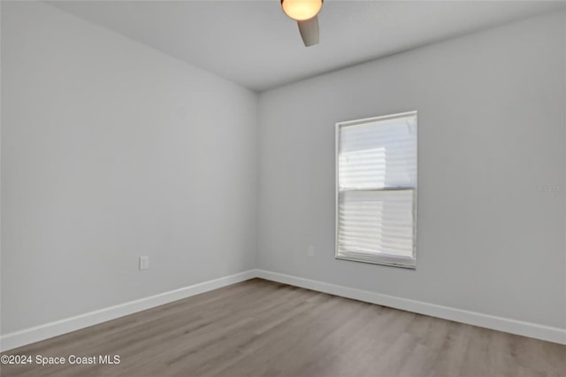 spare room with ceiling fan and light hardwood / wood-style flooring