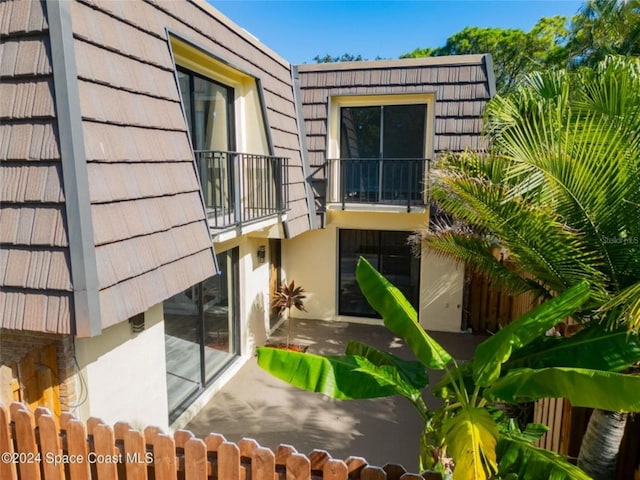 exterior space with a patio area and a balcony