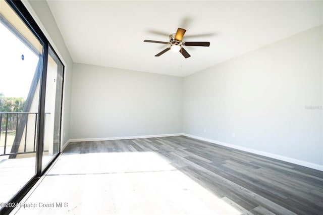 spare room featuring hardwood / wood-style flooring and ceiling fan