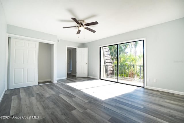 unfurnished bedroom with access to exterior, ceiling fan, and dark hardwood / wood-style flooring