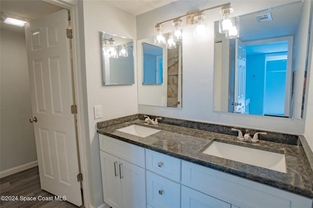 bathroom featuring hardwood / wood-style flooring and vanity