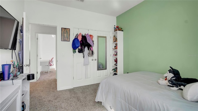 bedroom featuring light carpet