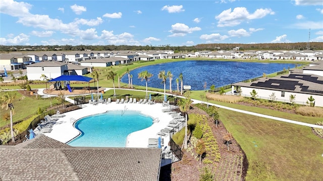 view of swimming pool featuring a water view