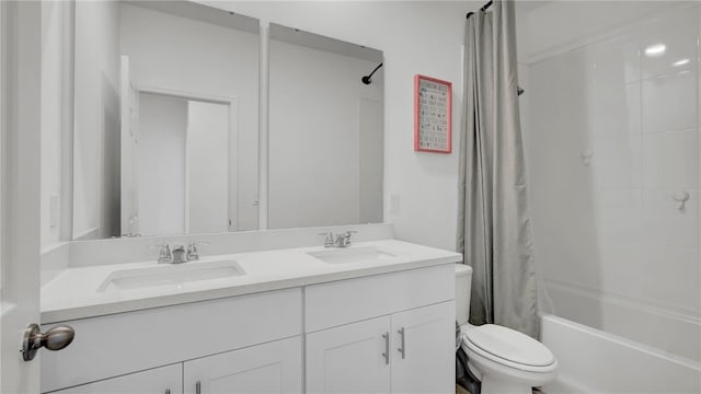 full bathroom featuring shower / bath combination with curtain, vanity, and toilet