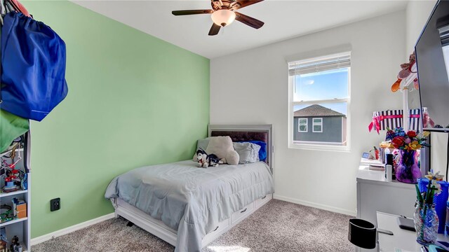 carpeted bedroom featuring ceiling fan