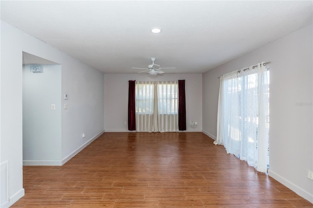 spare room with ceiling fan and light hardwood / wood-style flooring