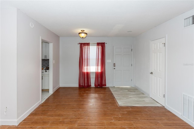 entrance foyer with wood-type flooring