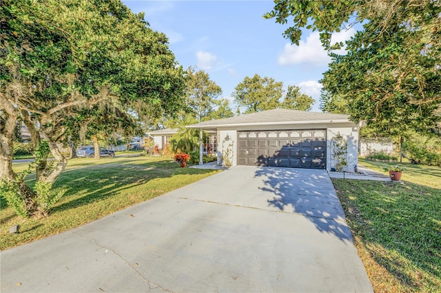 view of front facade with a garage and a front yard