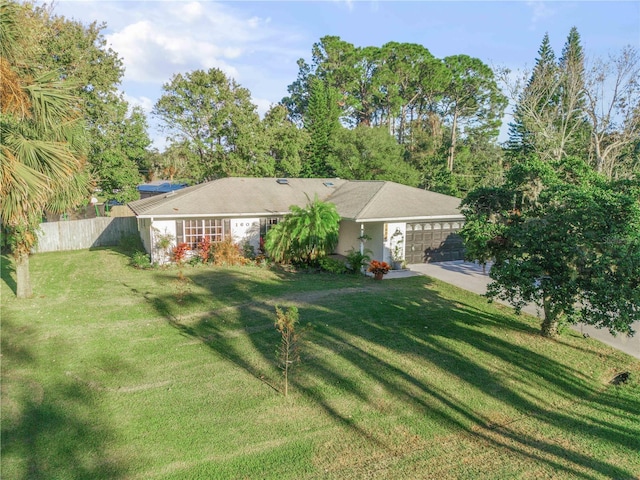 single story home with a garage and a front yard