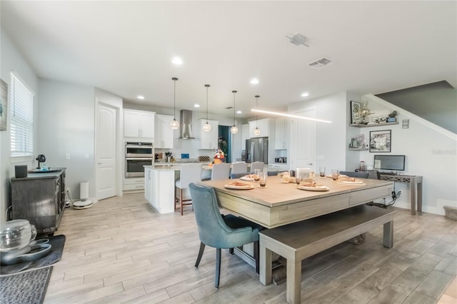 dining room with light hardwood / wood-style floors