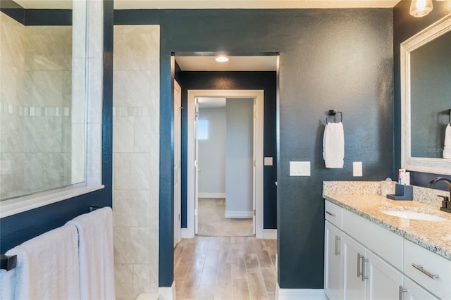 bathroom with hardwood / wood-style flooring and vanity