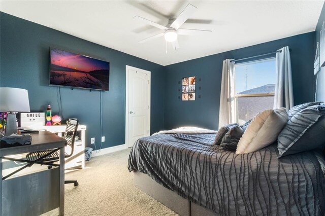 carpeted bedroom featuring ceiling fan