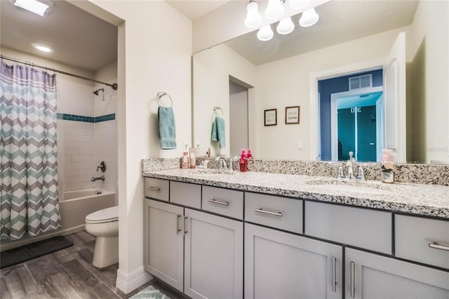 full bathroom featuring hardwood / wood-style floors, vanity, toilet, and shower / bath combination with curtain