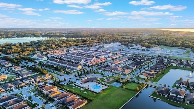 birds eye view of property with a water view