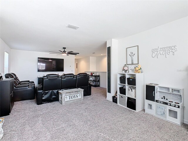 living room featuring ceiling fan and carpet floors