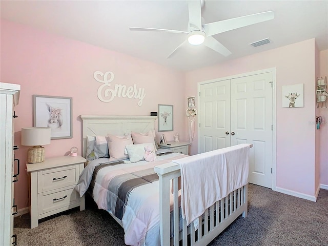 carpeted bedroom featuring ceiling fan and a closet