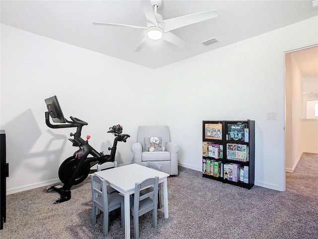 interior space featuring carpet and ceiling fan