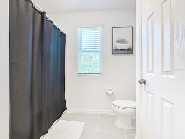 bathroom featuring tile patterned flooring and toilet