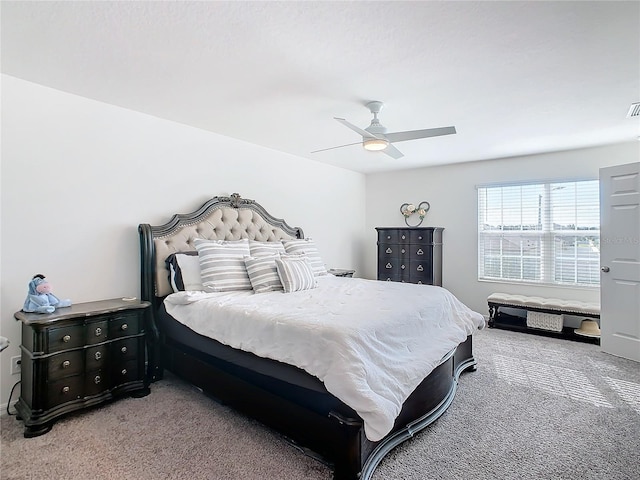 bedroom with ceiling fan and carpet floors