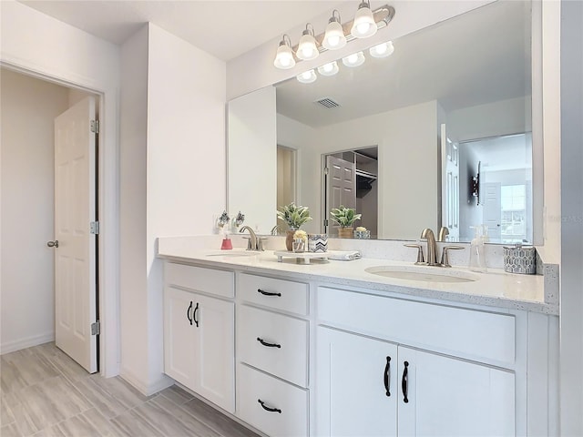 bathroom featuring vanity and wood-type flooring