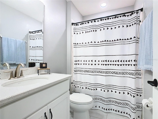 bathroom with a shower with shower curtain, vanity, toilet, and tile patterned flooring