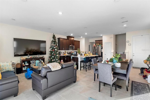 living room featuring light tile patterned flooring