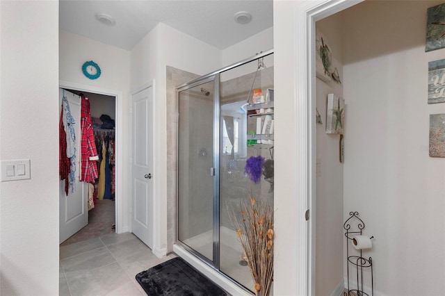 bathroom featuring tile patterned floors and walk in shower