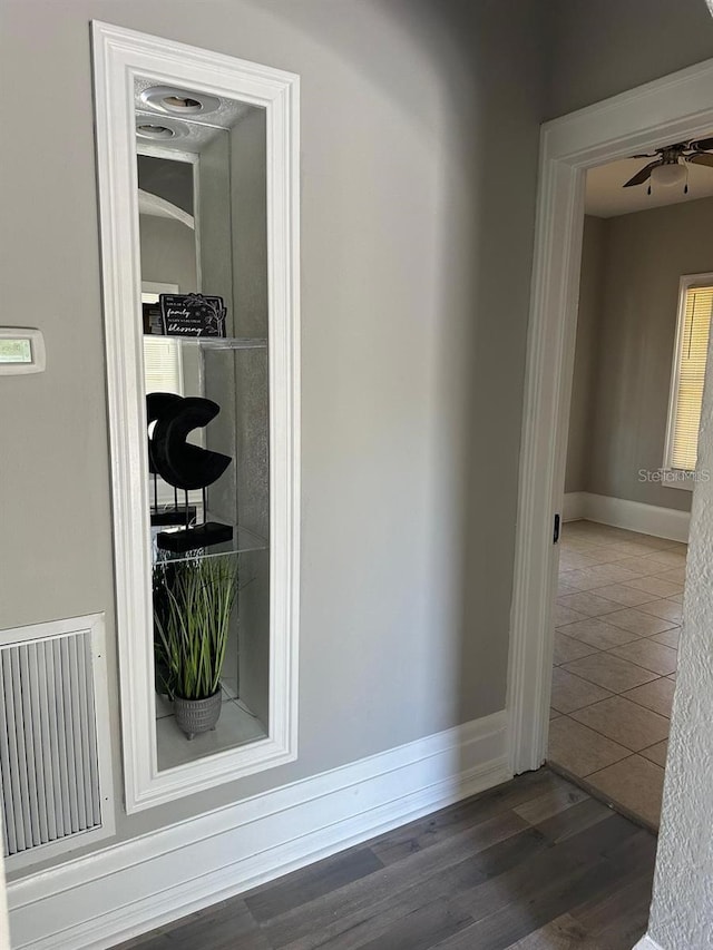 hallway featuring dark hardwood / wood-style floors