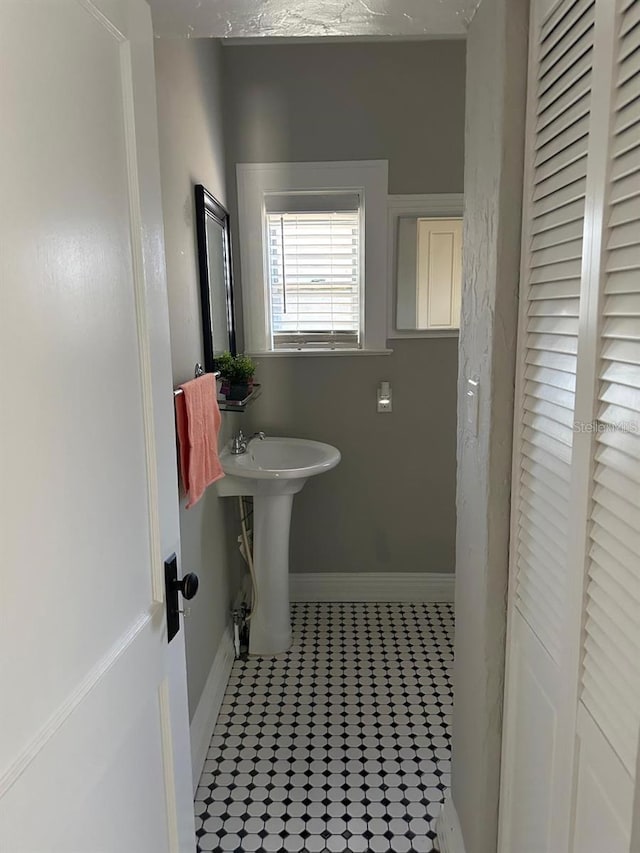 bathroom with tile patterned flooring and sink