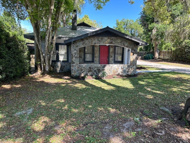 view of side of property featuring a yard