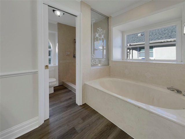 bathroom with hardwood / wood-style floors, toilet, ornamental molding, and independent shower and bath