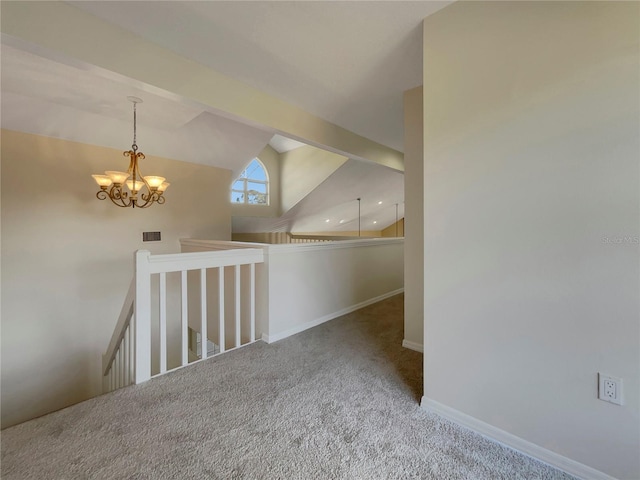 interior space with lofted ceiling, carpet floors, and an inviting chandelier