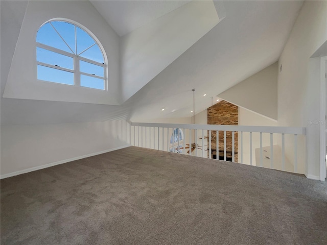 interior space featuring carpet and lofted ceiling