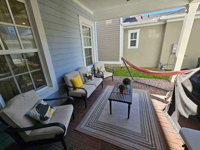 wooden deck featuring an outdoor living space and covered porch