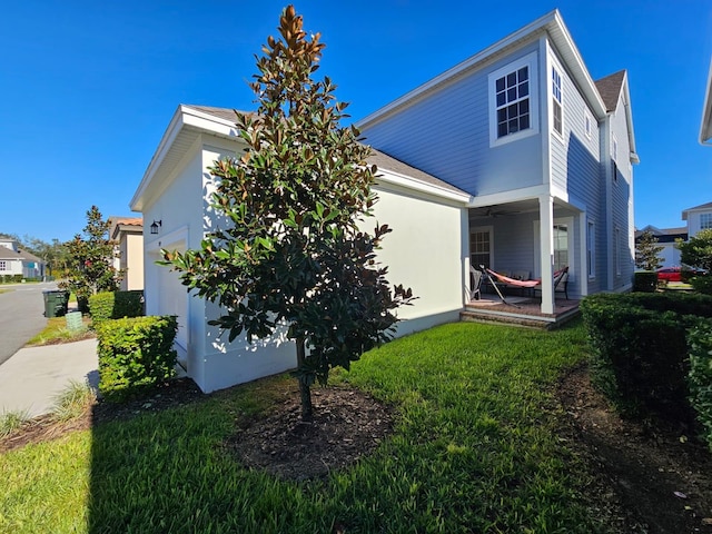 rear view of house with a lawn