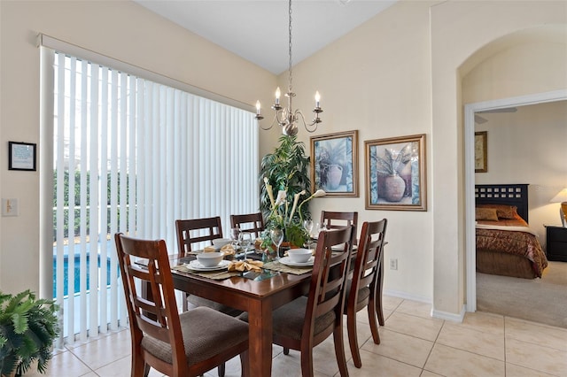 tiled dining space with a notable chandelier